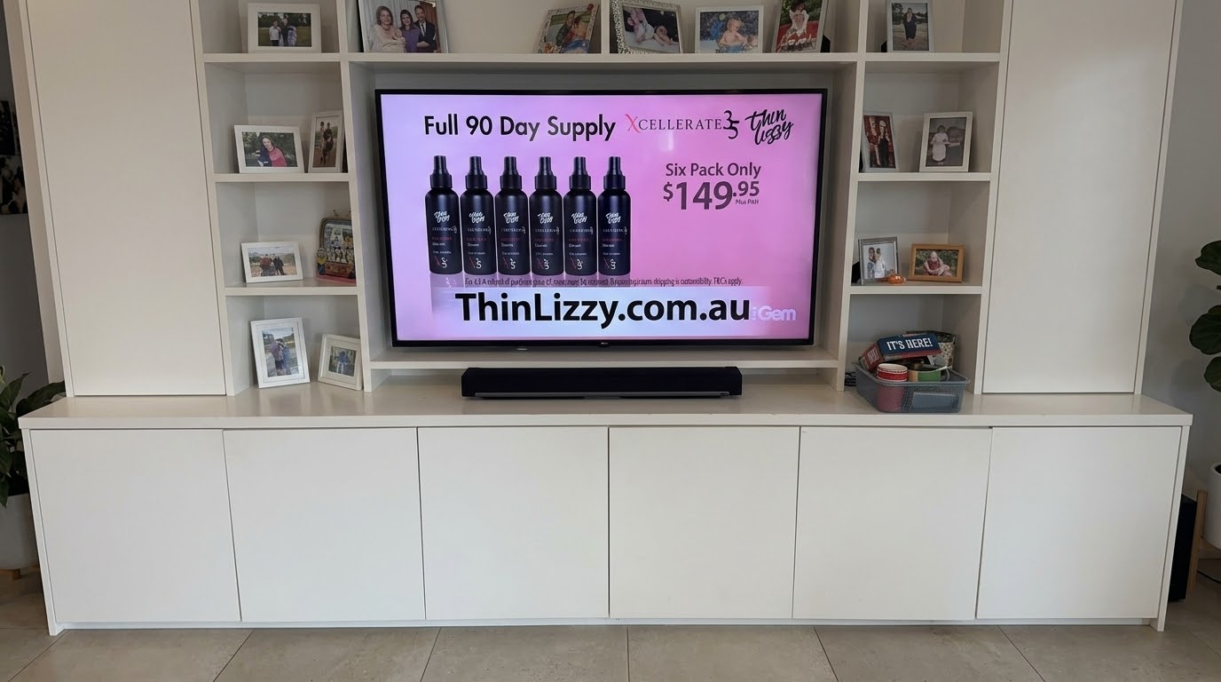 LG 55 inch TV mounted in built-in cabinetry niche in Willoughby, North Shore living room