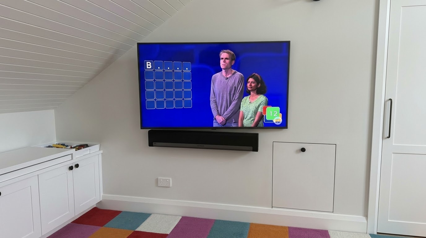 Samsung TV replacement on swivel bracket with Sonos Playbar in Chatswood playroom, North Shore